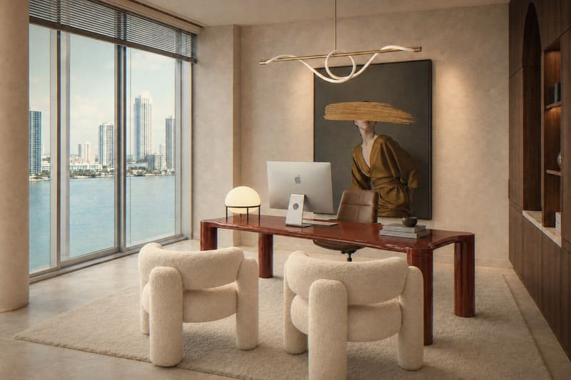 Home office with red desk and bouclé chairs